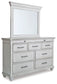 Kanwyn Queen Panel Bed with Mirrored Dresser Benchcraft®