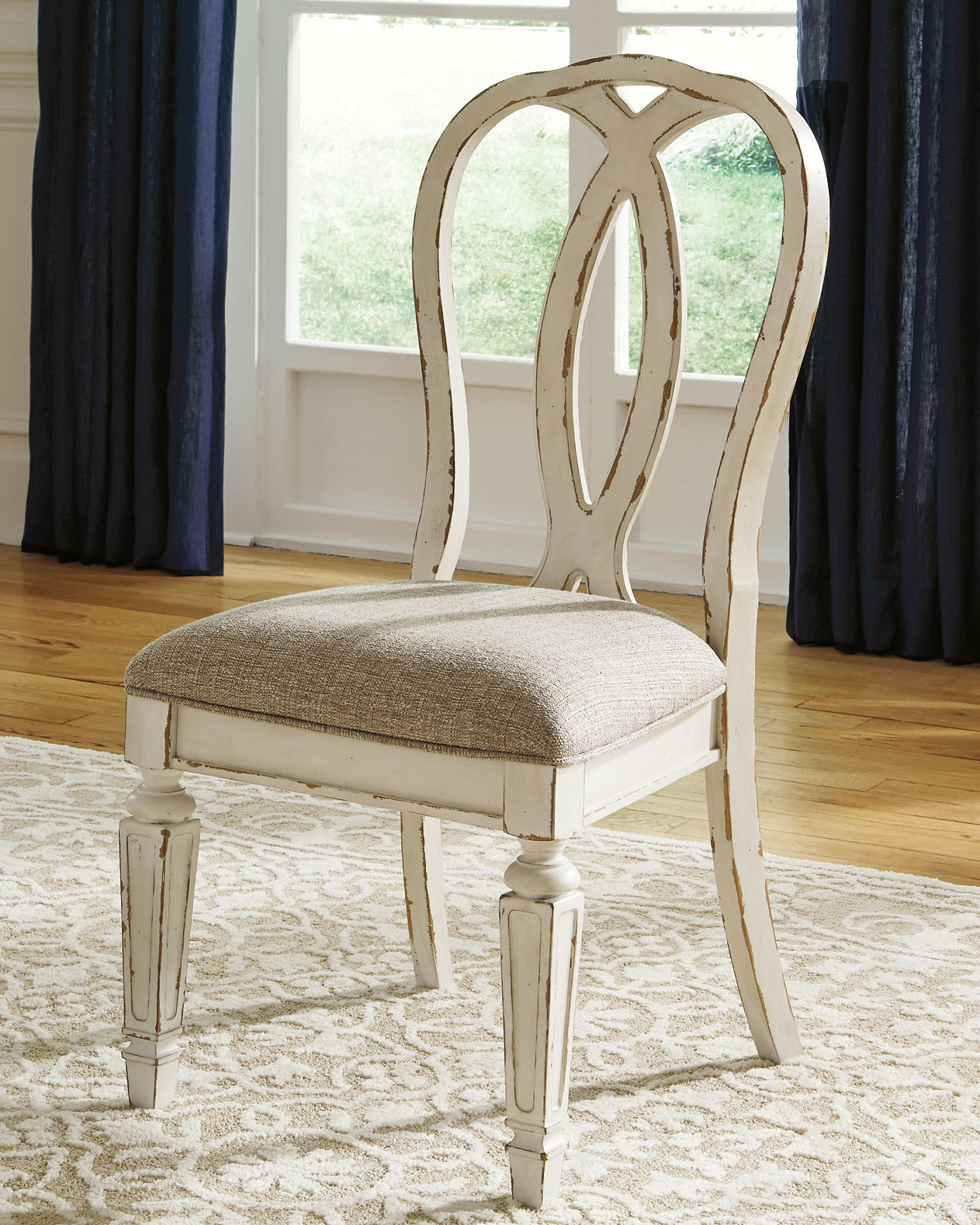 Realyn Dining Table and 8 Chairs Signature Design by Ashley®