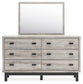 Vessalli King Panel Bed with Mirrored Dresser, Chest and Nightstand Signature Design by Ashley®