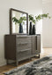 Arkenton California King Panel Bed with Mirrored Dresser and Chest Ashley®