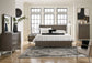 Arkenton California King Panel Bed with Mirrored Dresser, Chest and Nightstand Ashley®