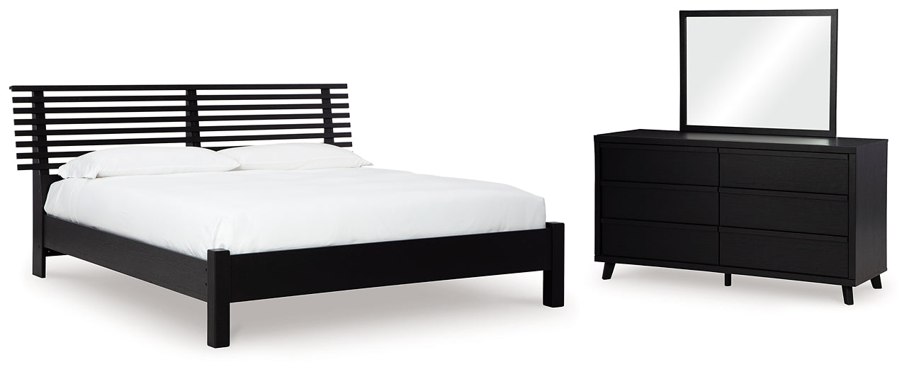 Danziar King Panel Bed with Mirrored Dresser Signature Design by Ashley®