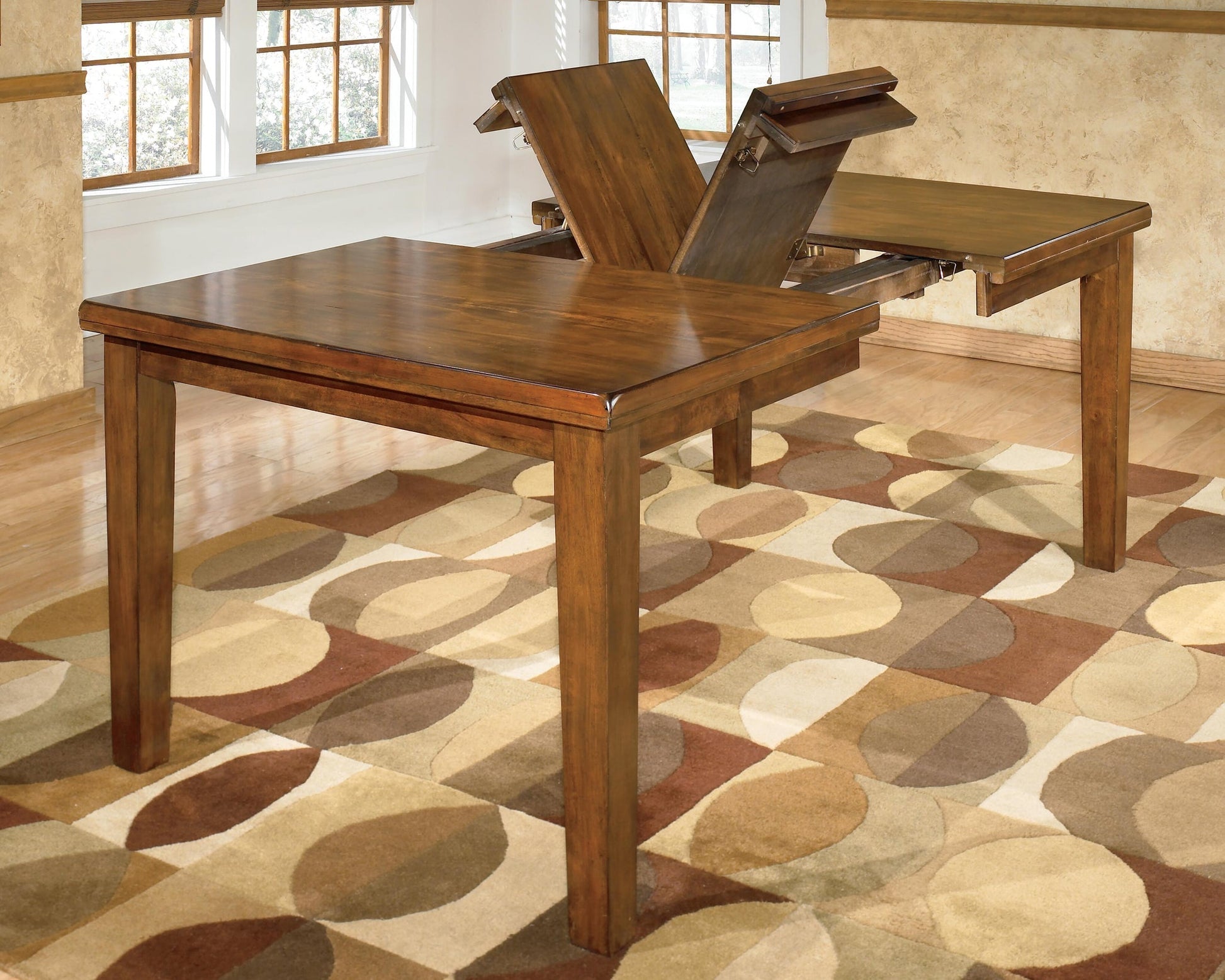 Ralene RECT DRM Butterfly EXT Table Signature Design by Ashley®