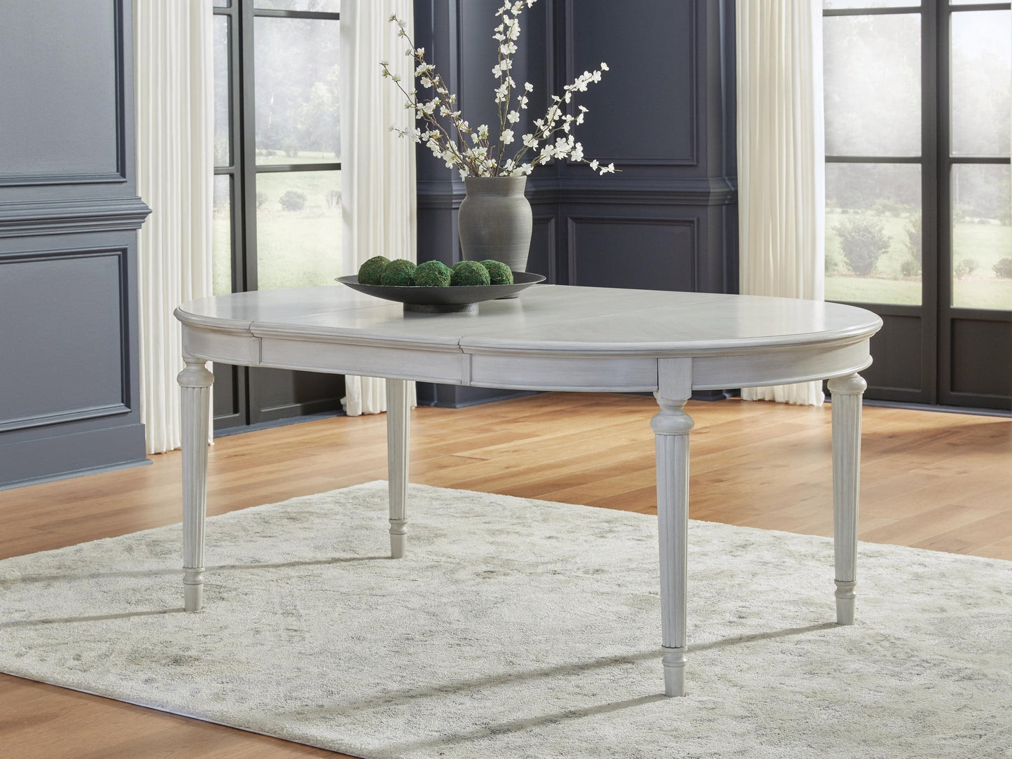 Montelaine Oval Dining Room EXT Table Benchcraft®