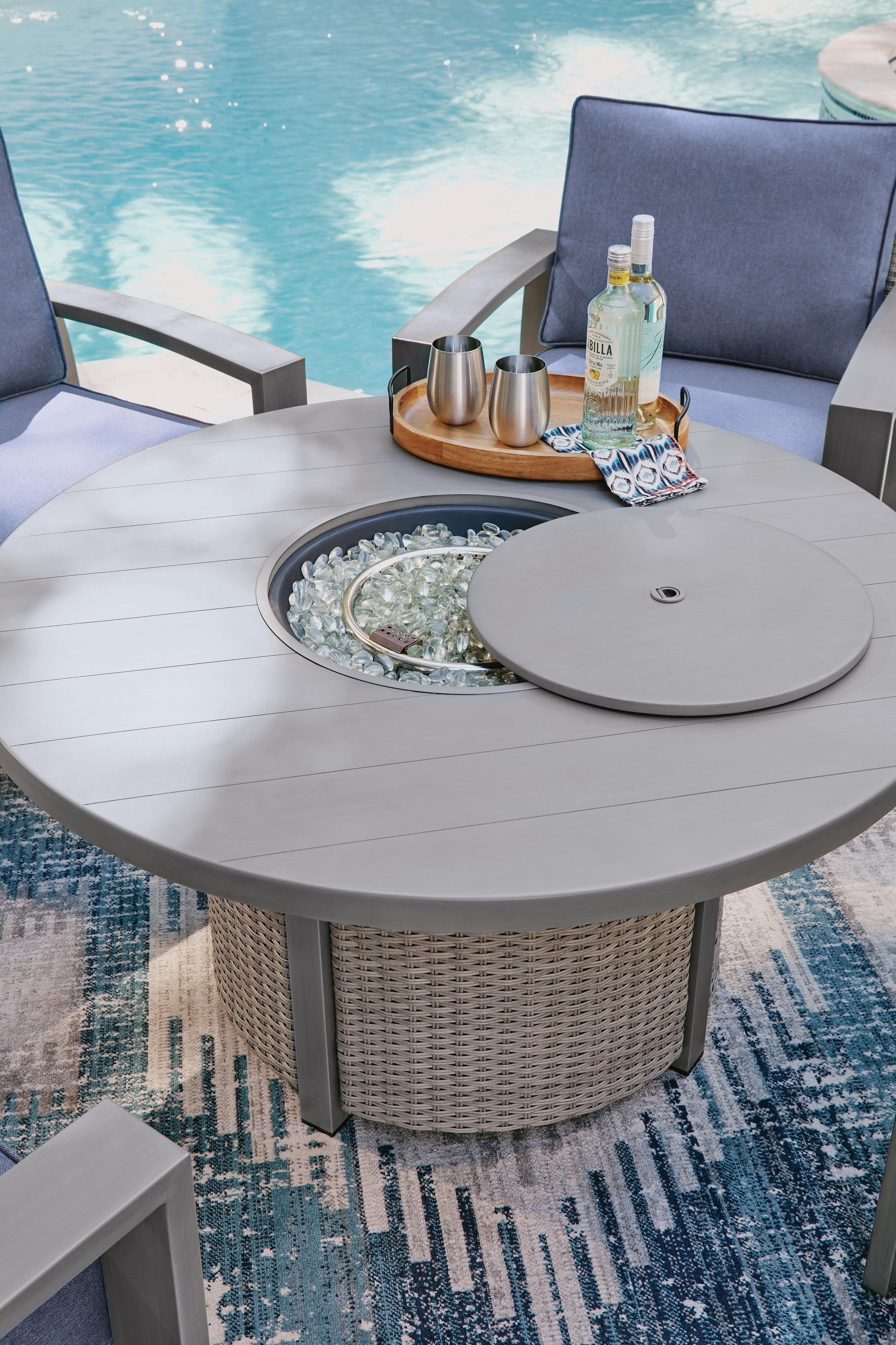 Half Moon Beach Round Fire Pit Table Signature Design by Ashley®