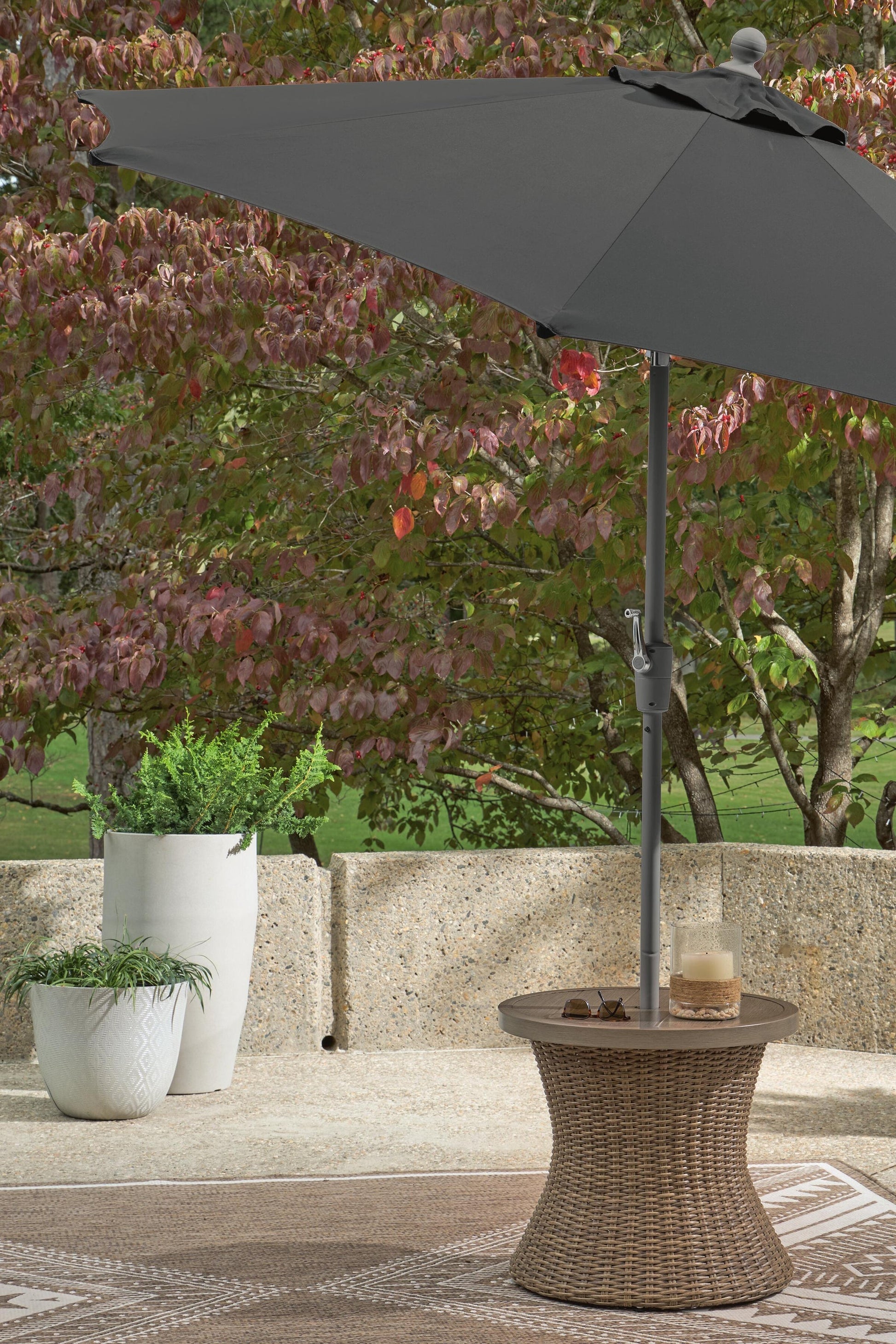 Laguna Heights Round End Table w/UMB OPT Signature Design by Ashley®