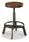Torjin Counter Height Dining Table and 4 Barstools Signature Design by Ashley®