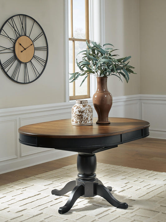 Clorazi Oval DRM Butterfly EXT Table Signature Design by Ashley®