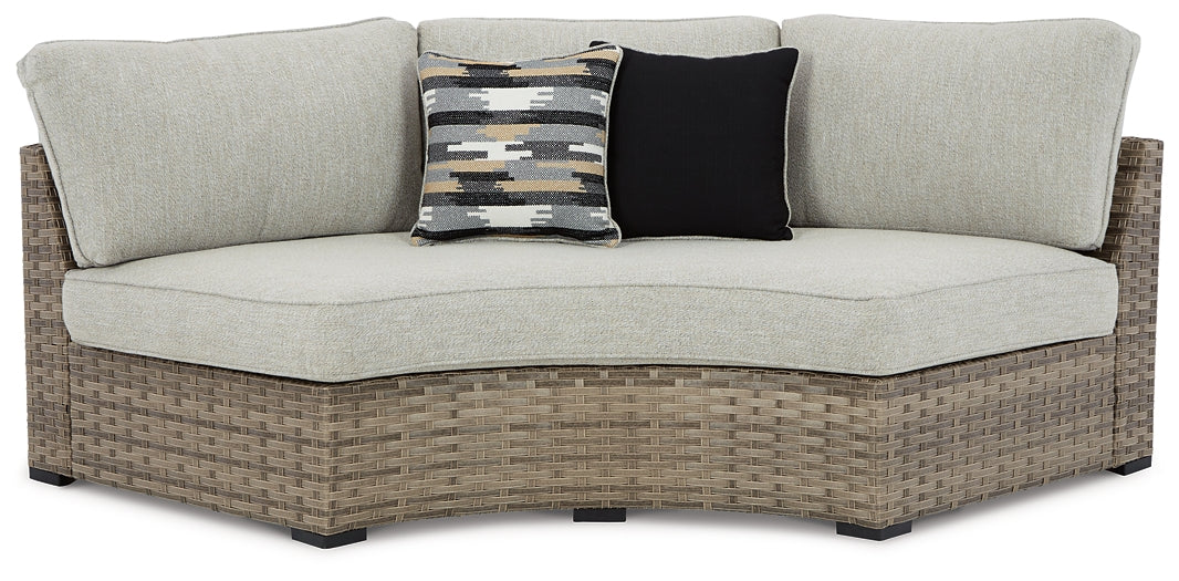 Calworth Curved Loveseat with Cushion Signature Design by Ashley®