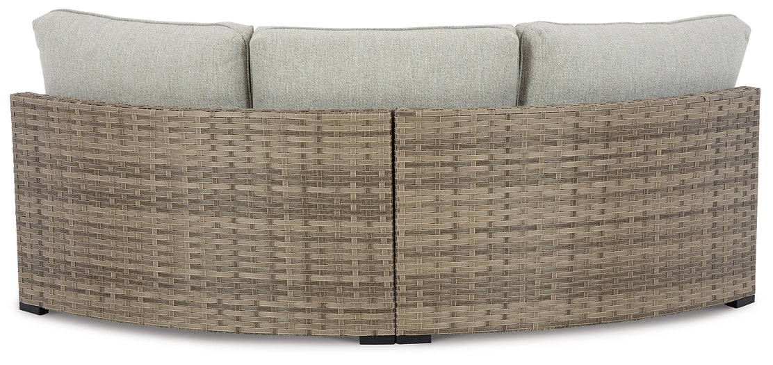 Calworth Curved Loveseat with Cushion Signature Design by Ashley®