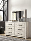 Cambeck Queen Panel Bed with 4 Storage Drawers with Mirrored Dresser Signature Design by Ashley®