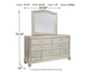 Coralayne King Upholstered Bed with Mirrored Dresser Signature Design by Ashley®
