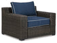 Grasson Lane Outdoor Sofa and 2 Chairs with Coffee Table Signature Design by Ashley®