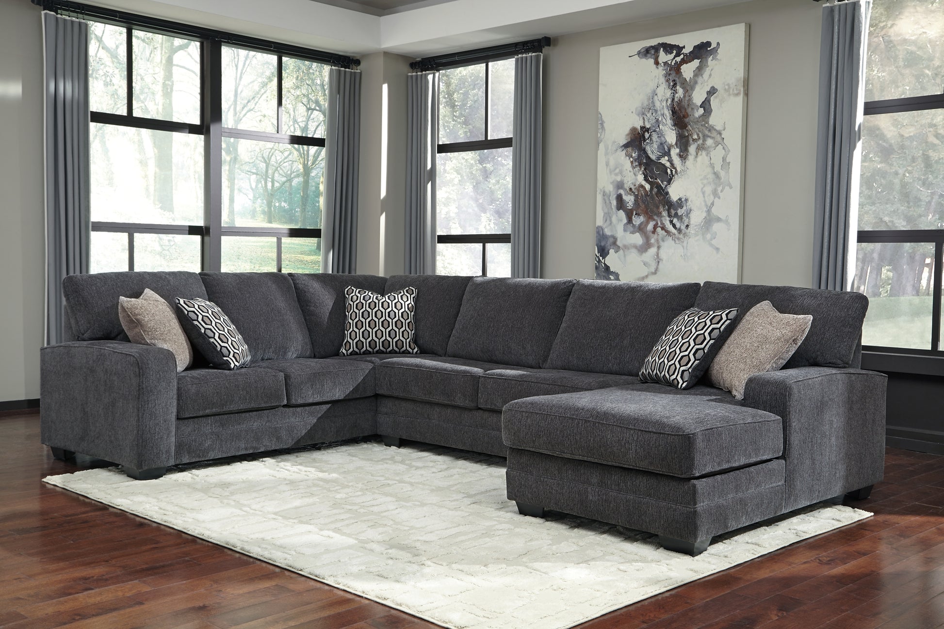 Tracling 3-Piece Sectional with Ottoman Benchcraft®