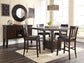 Haddigan Counter Height Dining Table and 4 Barstools with Storage Signature Design by Ashley®