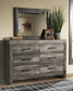 Wynnlow King Crossbuck Panel Bed with Mirrored Dresser, Chest and Nightstand Signature Design by Ashley®