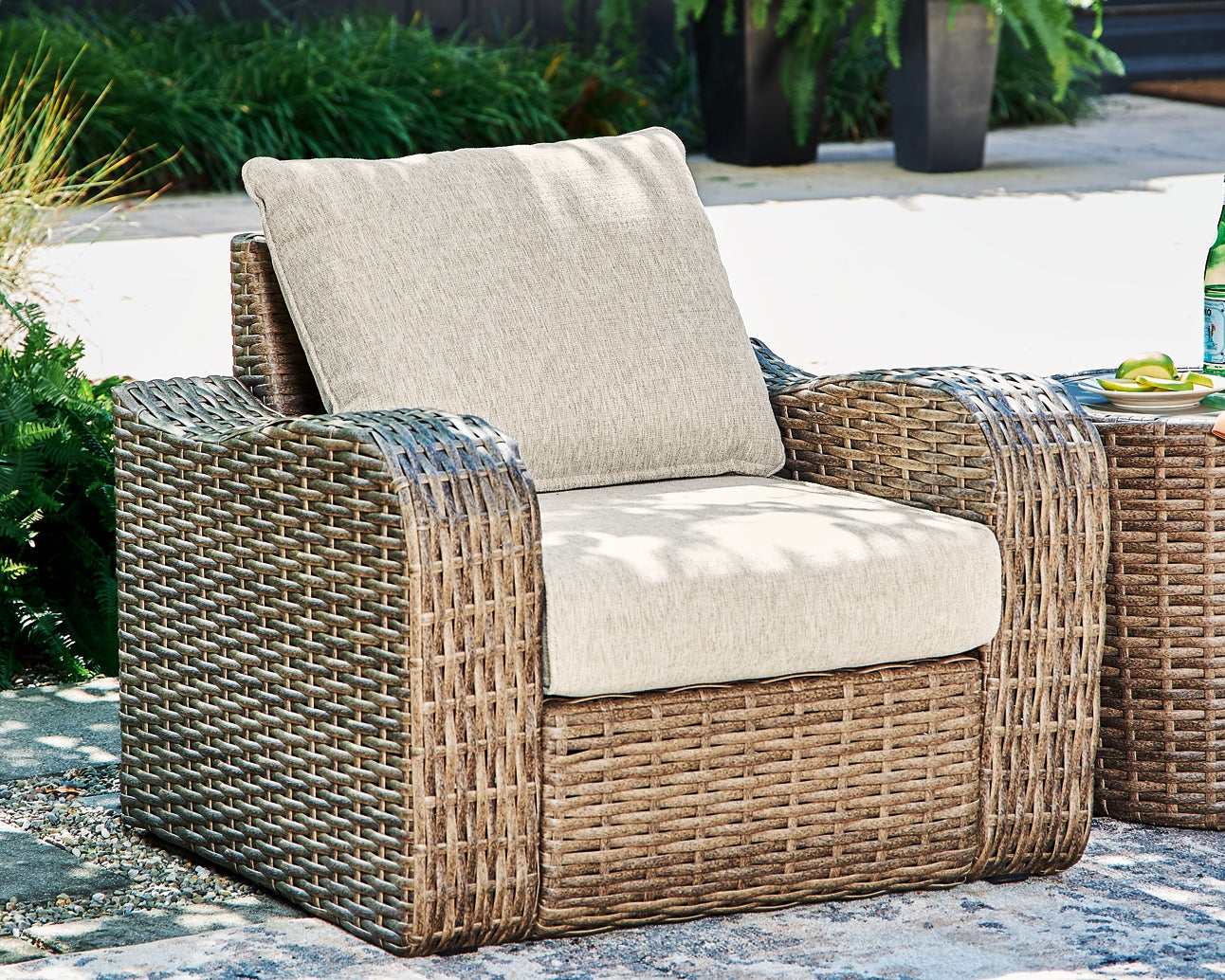 Sandy Bloom Outdoor Lounge Chair and Ottoman Signature Design by Ashley®